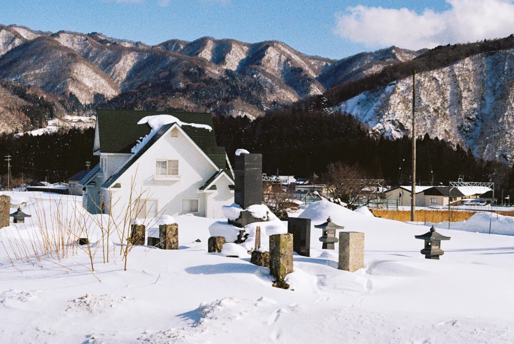 Lawson convenience store glowing at night with parked bicycles